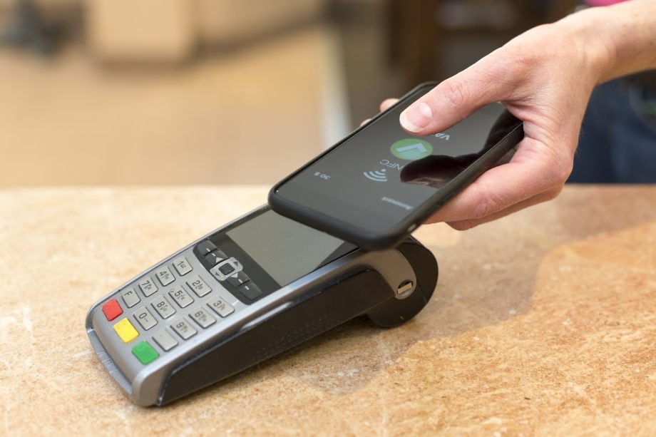 Customer paying with NFC technology