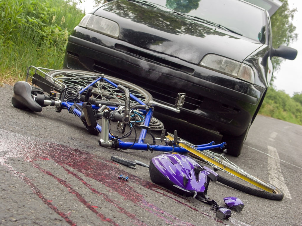 Arranged scene of bicycle accident on the road