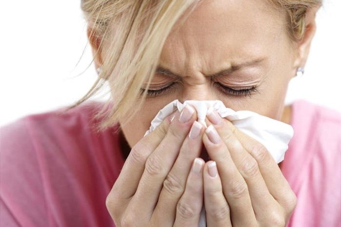 Woman Sneezing