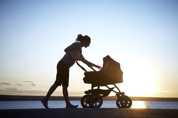 Silhouette of young mother enjoying motherhood
