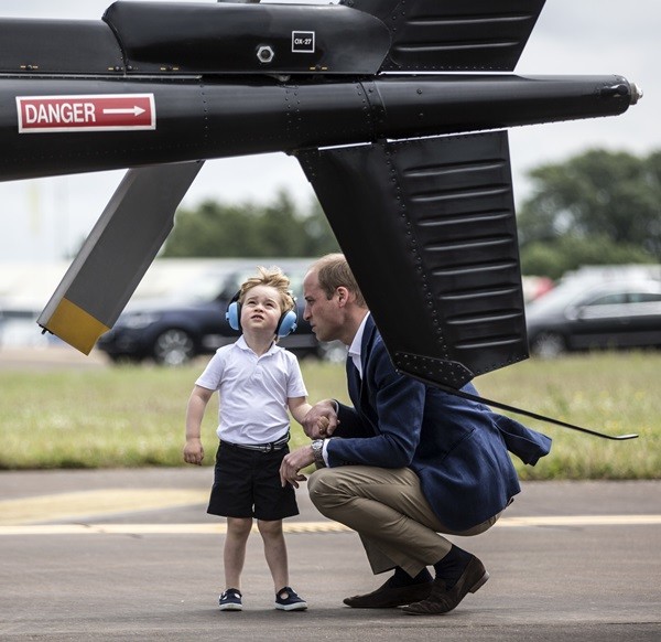 Prince William with son Prince George during a visit to the Royal International Air Tattoo at RAF Fairford